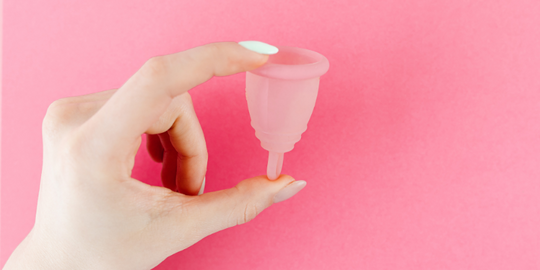 Hand holding Vivacup menstrual product