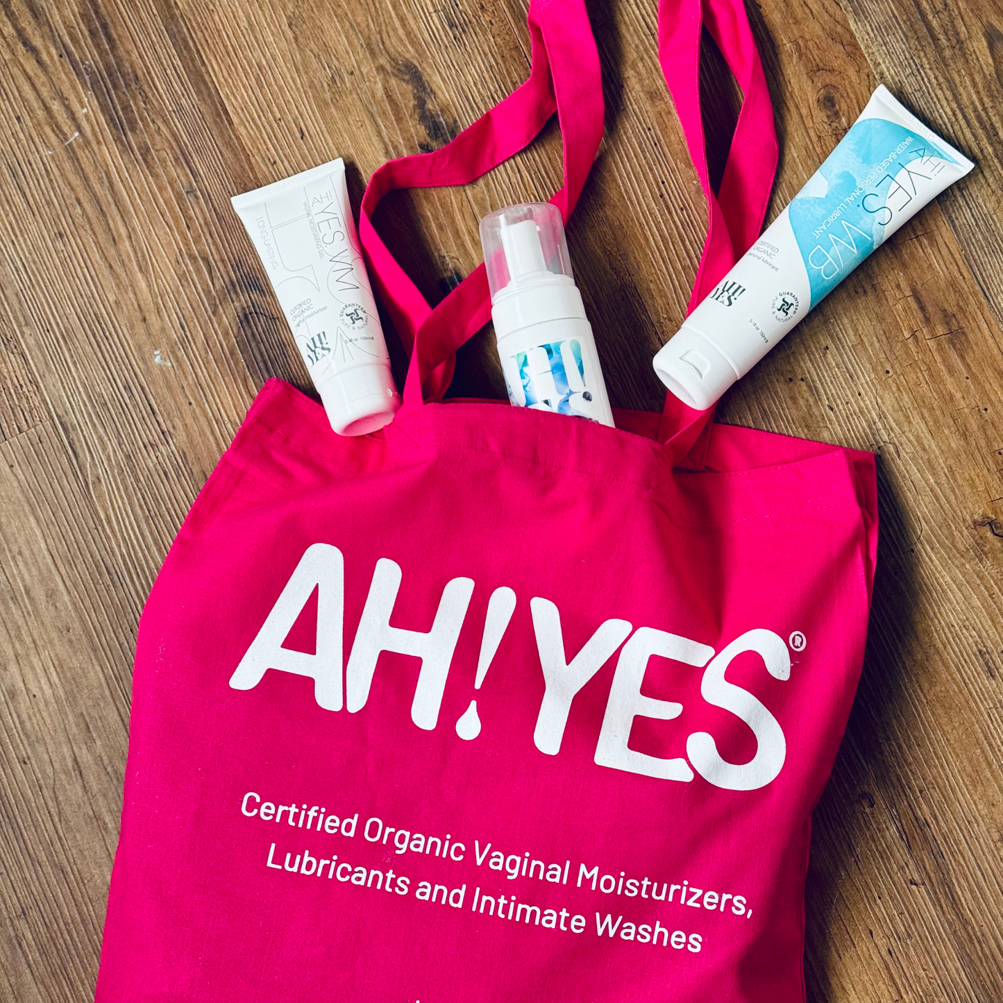 AH! YES® Tote Bag in pink with products alongside 