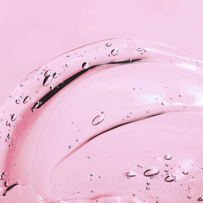 AH! YES VM vaginal moisturizer is a clear gel, image show the clear gel on a pink background.